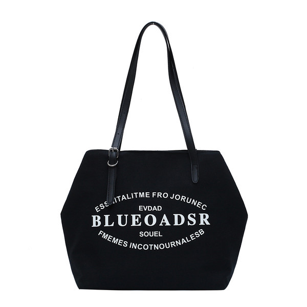 Liela tekstila soma ar eko ādas rokturiem un uzrakstiem