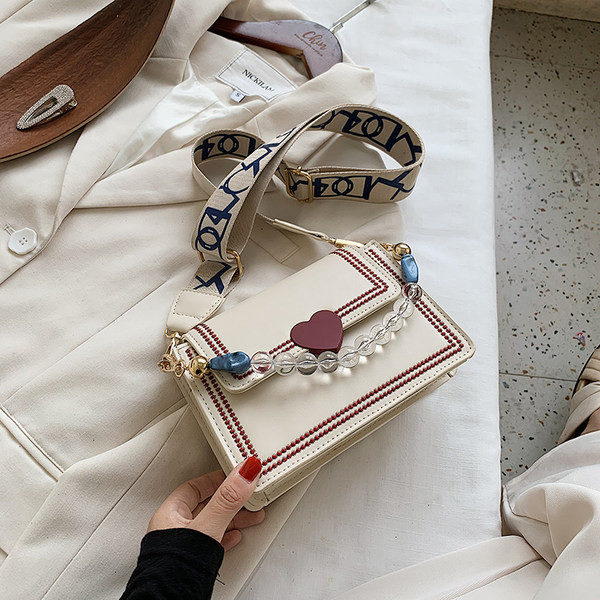 Μικρή μοντέρνα τσάντα eco suede με υφασμάτινη και πέρλες  λαβή