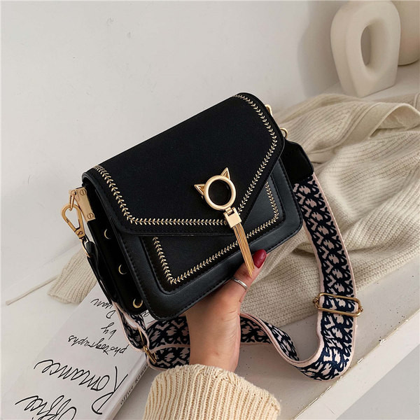 Moderna ženska torba od eko kože s tekstilnom ručkom