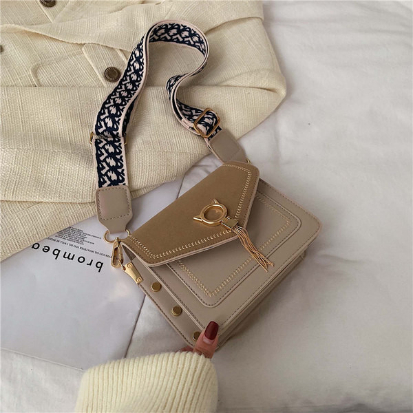 Moderna ženska torba od eko kože s tekstilnom ručkom