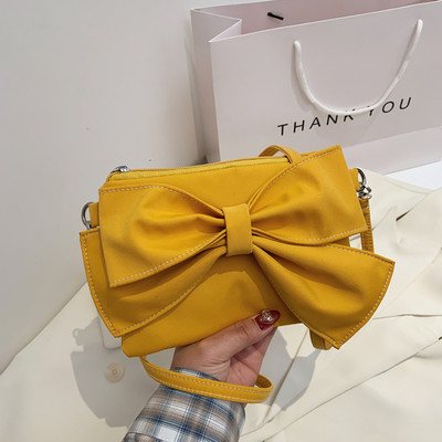 Γυναικεία έκο δερμάτινη τσάντα με κορδέλα και λαβή