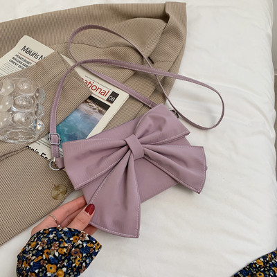 Γυναικεία έκο δερμάτινη τσάντα με κορδέλα και λαβή