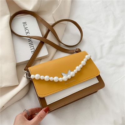 Γυναικεία τσάντα με μαργαριτάρια και μακριά λαβή