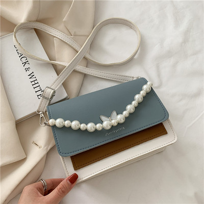 Γυναικεία τσάντα με μαργαριτάρια και μακριά λαβή