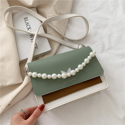 Γυναικεία τσάντα με μαργαριτάρια και μακριά λαβή