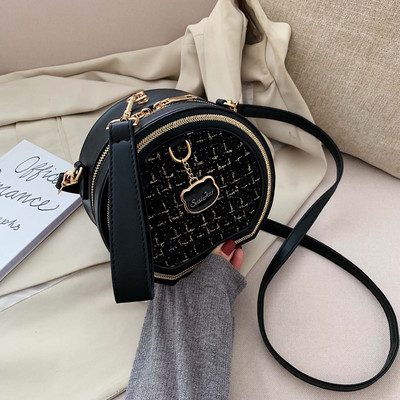 Στρογγυλή τσάντα από οικολογικό δέρμα και υφάσματα με μακριά λαβή