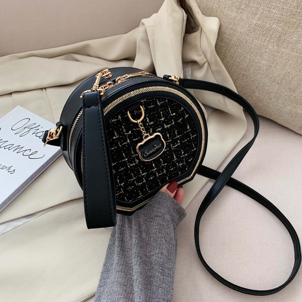 Στρογγυλή τσάντα από οικολογικό δέρμα και υφάσματα με μακριά λαβή