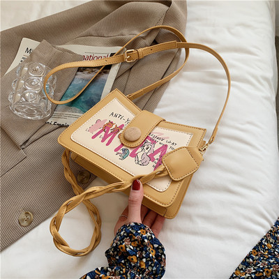 Γυναικεία τσάντα με απλικέ χρώμα και κλείσιμο με φερμουάρ