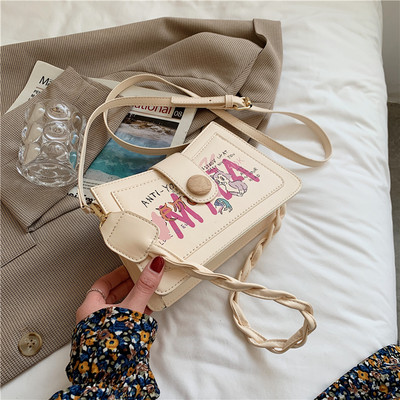 Γυναικεία τσάντα με απλικέ χρώμα και κλείσιμο με φερμουάρ