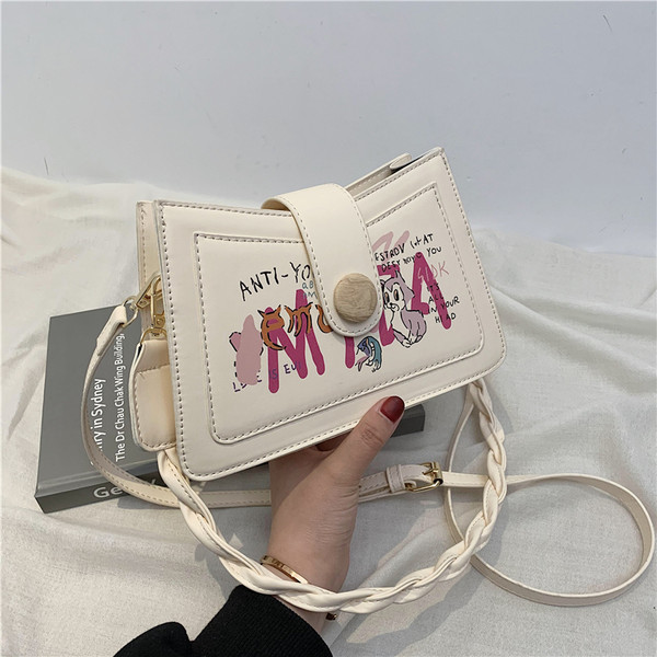 Γυναικεία τσάντα με απλικέ χρώμα και κλείσιμο με φερμουάρ