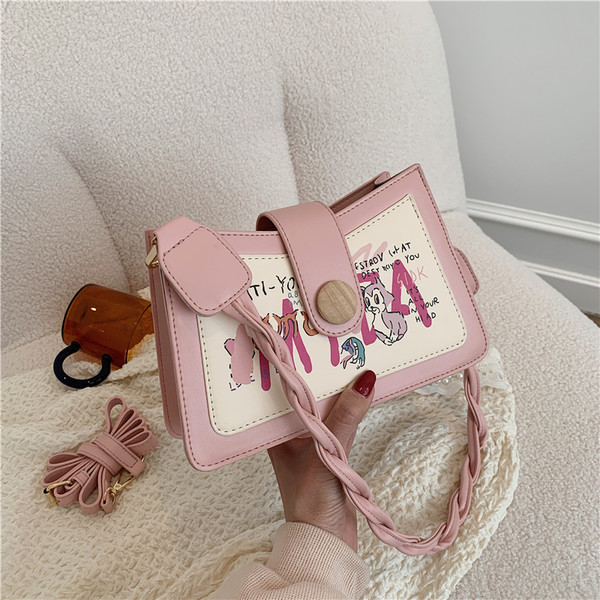 Γυναικεία τσάντα με απλικέ χρώμα και κλείσιμο με φερμουάρ