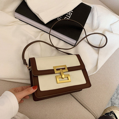 Moderna sieviešu soma ar garu rokturi un metāla aizdari