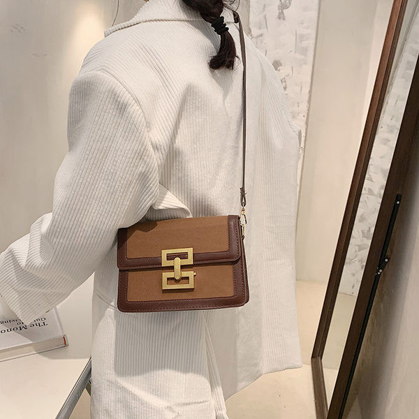 Moderna sieviešu soma ar garu rokturi un metāla aizdari