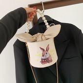 Γυναικεία τσάντα με κορδέλα και χρώμα απλικέ