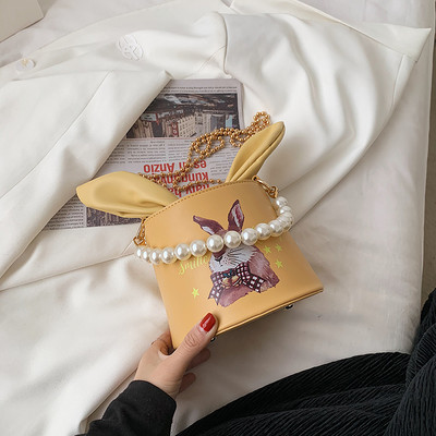 Γυναικεία τσάντα με κορδέλα και χρώμα απλικέ