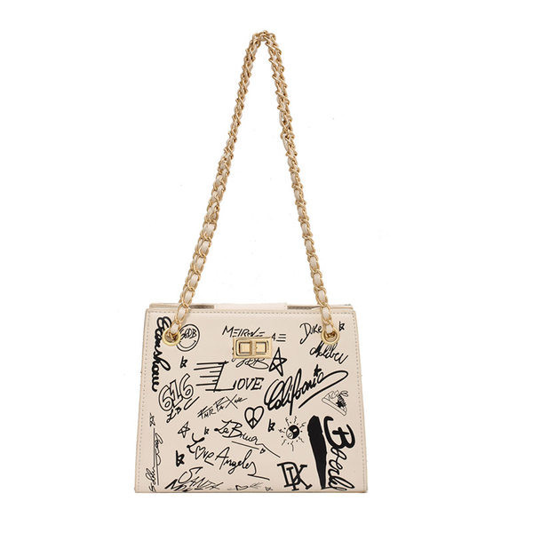 Geanta de dama din piele cu aplicatii si manere metalice