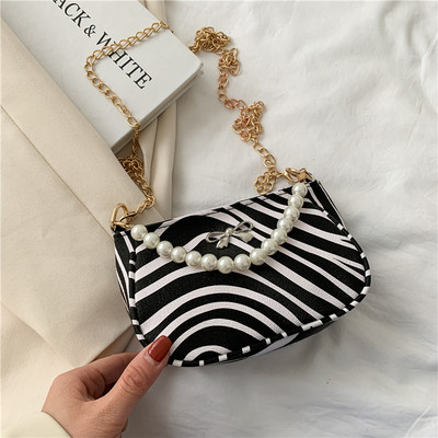 Σύγχρονη γυναικεία τσάντα με πέρλες και κορδέλα