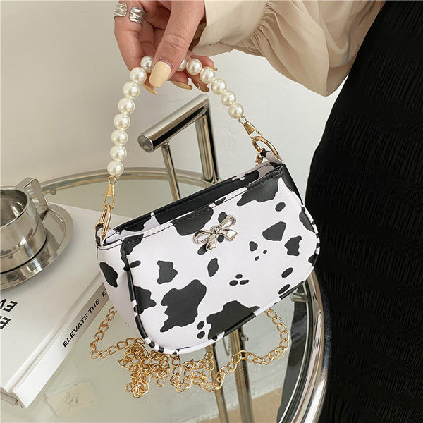 Σύγχρονη γυναικεία τσάντα με πέρλες και κορδέλα