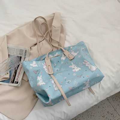 Γυναικεία τσάντα  με εφαρμογές και μακριά λαβή