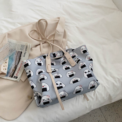 Γυναικεία τσάντα  με εφαρμογές και μακριά λαβή