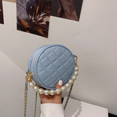 Geanta de dama cu forma rotunda si perle