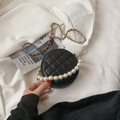 Geanta de dama cu forma rotunda si perle