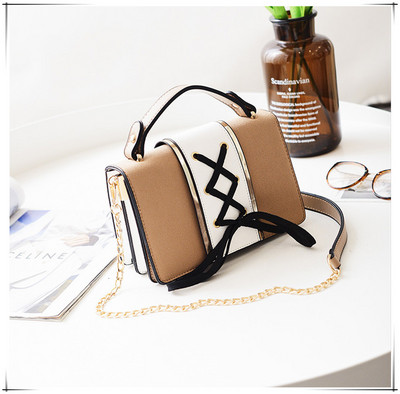 Γυναικεία μικρή τσάντα με κορδόνια και μακριά μεταλλική λαβή