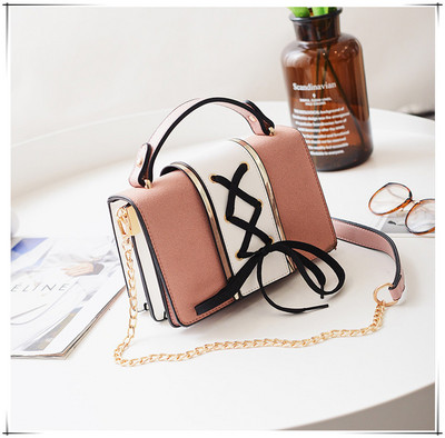 Γυναικεία μικρή τσάντα με κορδόνια και μακριά μεταλλική λαβή