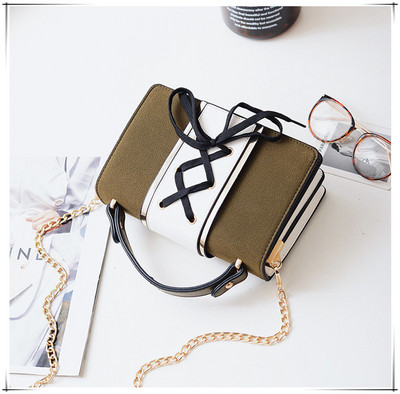 Γυναικεία μικρή τσάντα με κορδόνια και μακριά μεταλλική λαβή