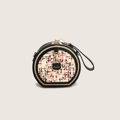 Moderna soma no eko ādas un apaļa tekstila