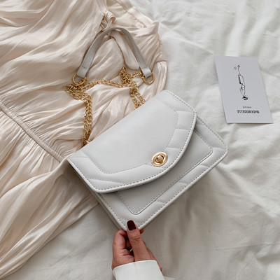 Moderna sieviešu soma no eko ādas ar garu metāla rokturi