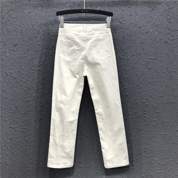 Sieviešu džinsi ar šķēlumiem un augstu vidukli