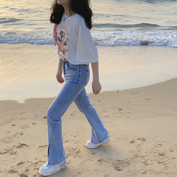 Retro stila sieviešu džinsi ar šķēlumiem un augstu vidukli