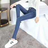 Sieviešu elastīgie džinsi ar pogām un kabatām