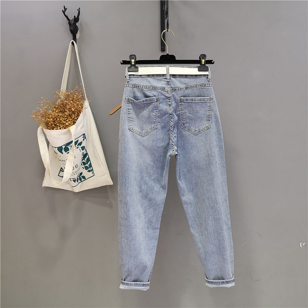 Blugi moderni de dama cu talie inalta si motive rupte in albastru