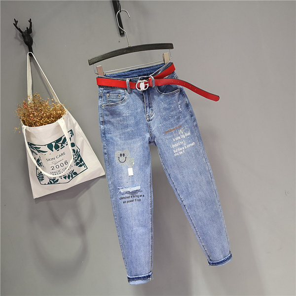 Jauns sieviešu džinsu modelis ar augstu vidukli un akmeņiem zilā krāsā