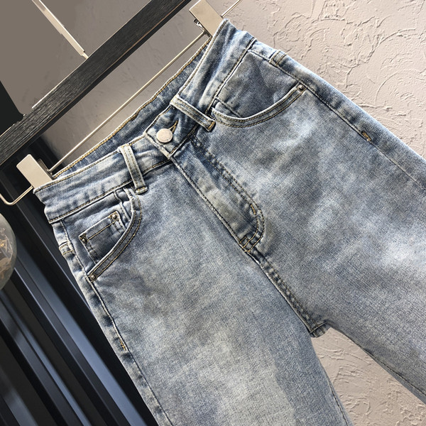 Sieviešu moderni džinsi ar augstu vidukli vienkrāsainu modeli