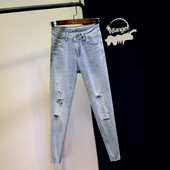 Sieviešu džinsi ar augstu vidukli un plēstiem motīviem - zilā krāsā