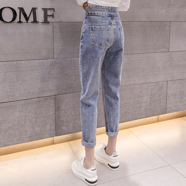 Sieviešu džinsu taisns modelis ar augstu vidukli - un metāla pogām