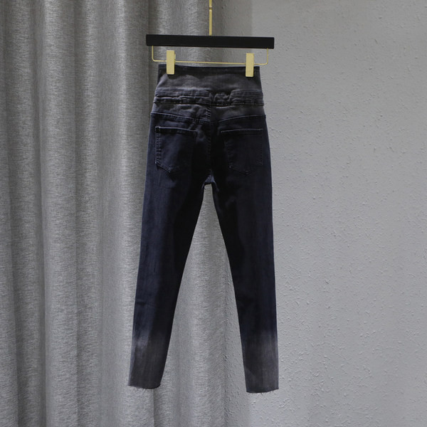 Sieviešu pieguloši džinsi ar pogām zilā un melnā krāsā