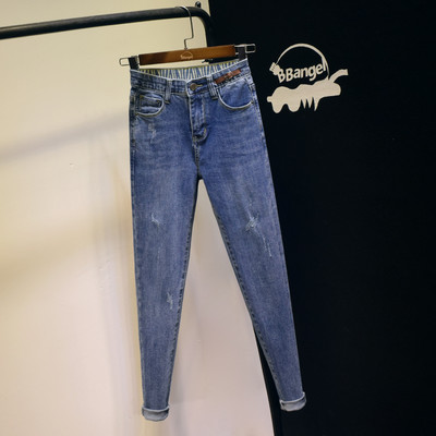 Ikdienas sieviešu džinsi ar augstu vidukli un emblēmu zilā krāsā