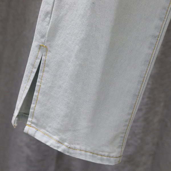 Sieviešu ikdienas džinsi ar šķēlumiem zilā krāsā