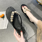 Sieviešu ikdienas čības ar plakanu zoli un pērļu rotājumu