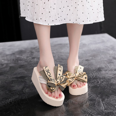 Sieviešu čības starp pirkstiem ar lentīti