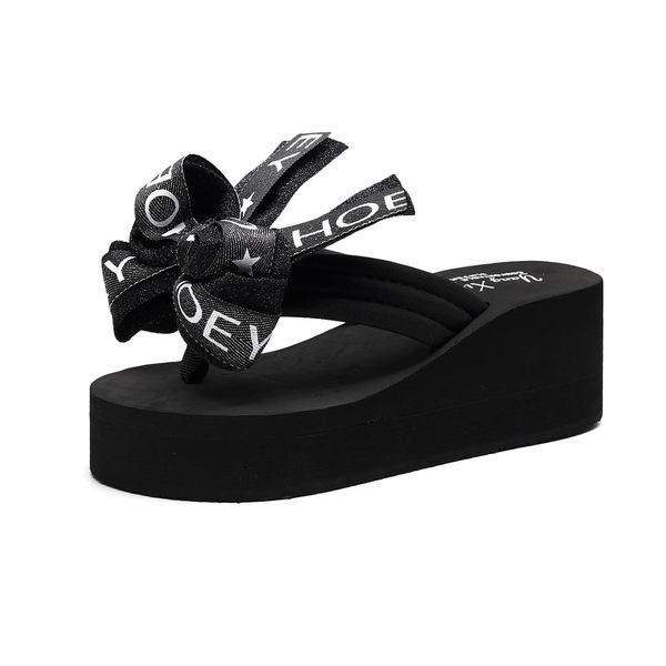 Sieviešu čības starp pirkstiem ar lentīti