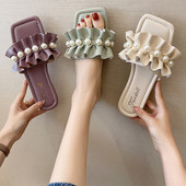 Papuci de damă din piele cu bucle și perle