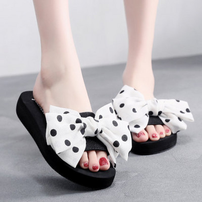 Γυναικείες παντόφλες με υψηλή πλατφόρμα και κορδέλα δύο μοντέλα