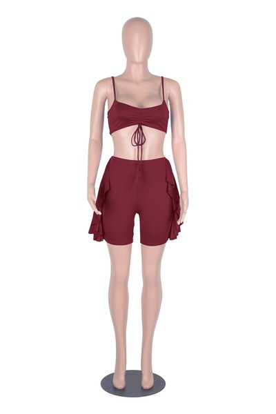 Aktualan ženski komplet - pripijene hlače s resicama i poprsje