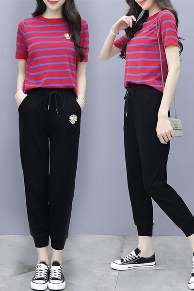 Dnevni set majice i sportskih hlača s aplikacijom tratinčice