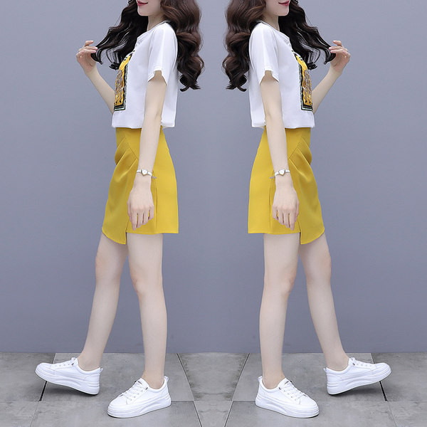 Sieviešu ikdienas komplekts ar aplikācijām un asimetriskiem svārkiem